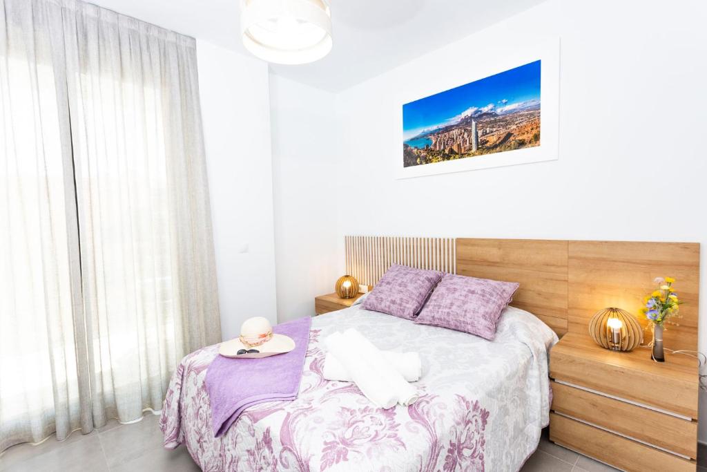 a bedroom with a bed with a plate on it at Calpe Beach in Calpe
