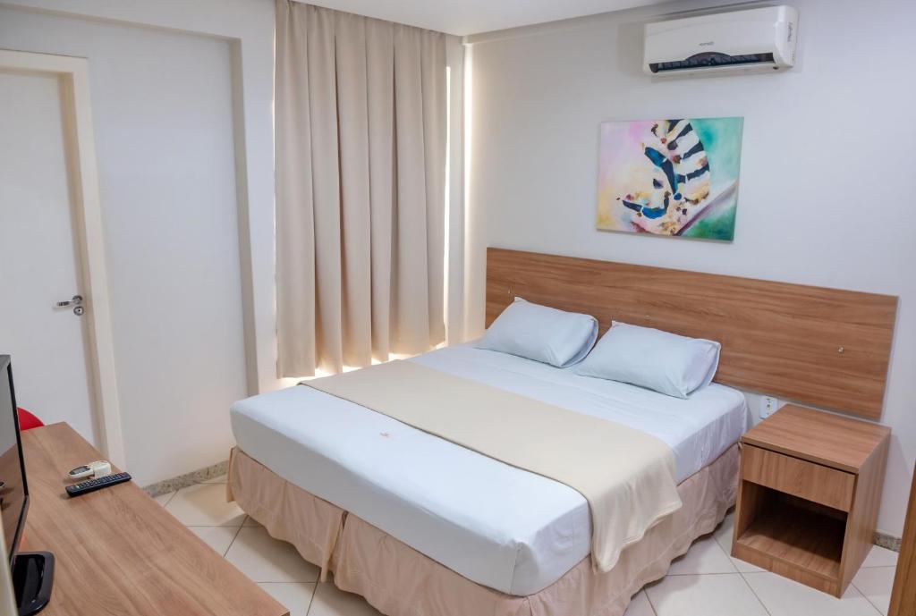 Postel nebo postele na pokoji v ubytování Hotel QualitySul