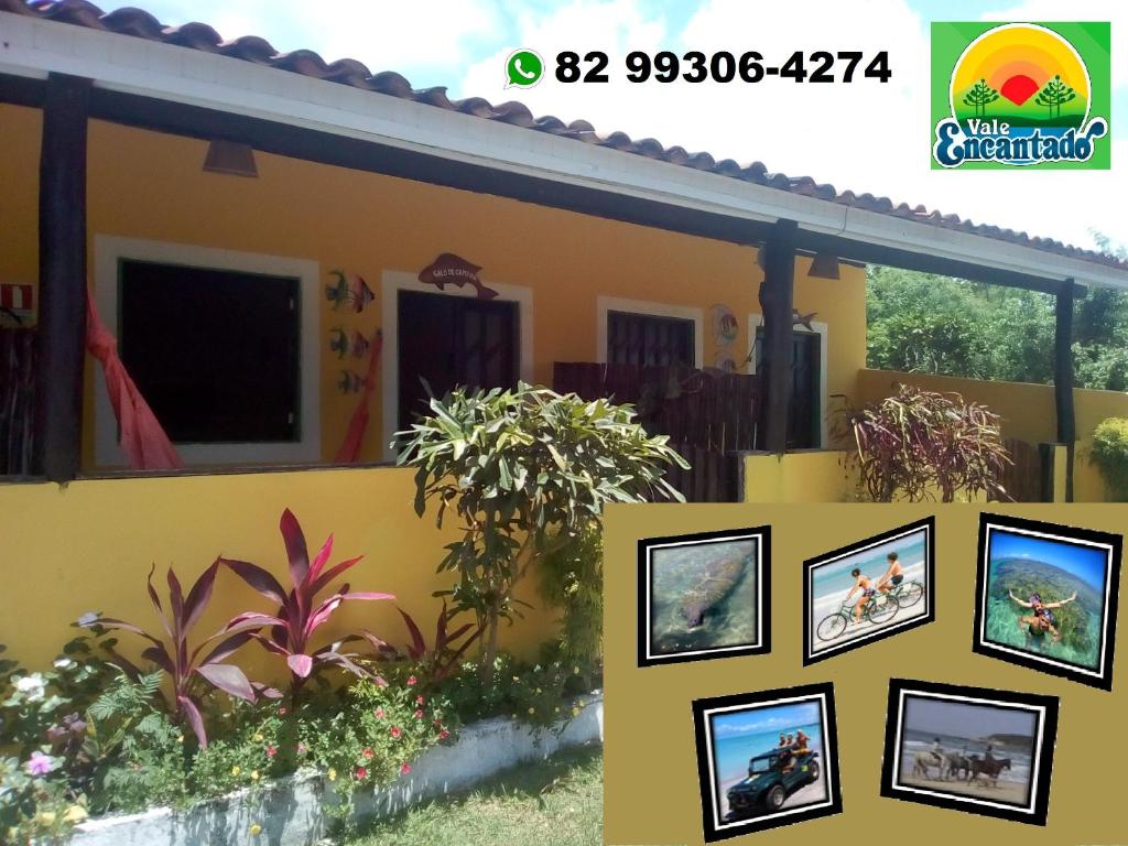 a house with a picture frame on the wall at Pousada Vale Encantado in São Miguel dos Milagres