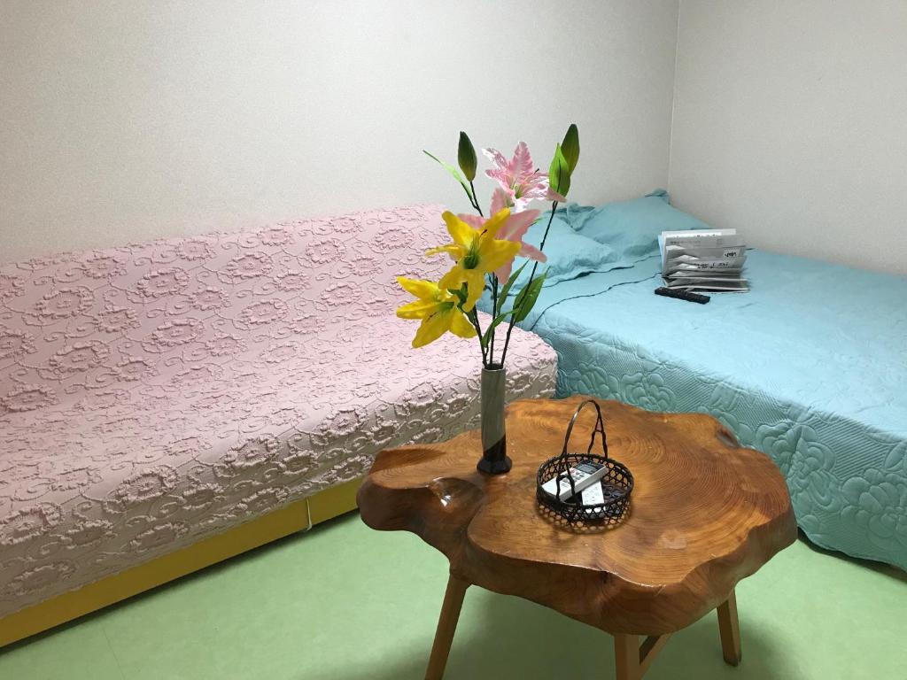 Postel nebo postele na pokoji v ubytování Hotel Wish HANA