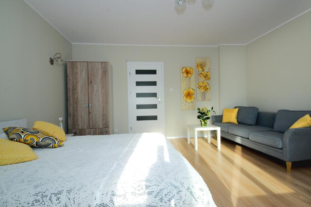 Posteľ alebo postele v izbe v ubytovaní Apartament Kościuszko