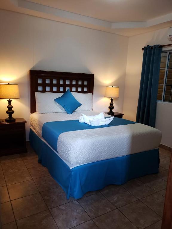 Postel nebo postele na pokoji v ubytování Hotel Playa Caribe