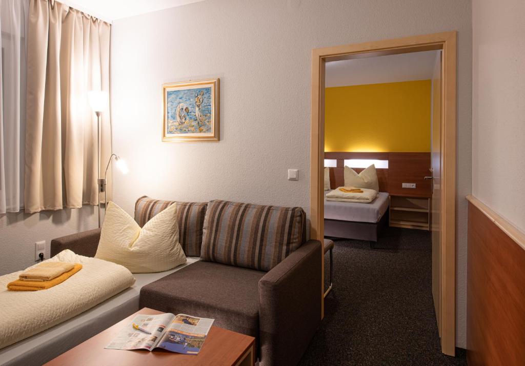 Postel nebo postele na pokoji v ubytování Pension-Café-Libelle