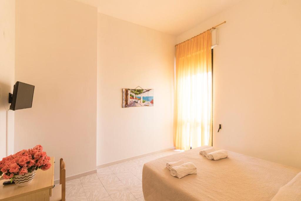 Postel nebo postele na pokoji v ubytování Albergo Palazzo