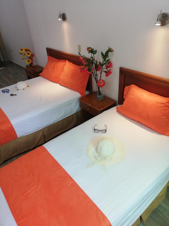 Postel nebo postele na pokoji v ubytování Hostal España
