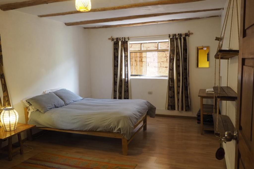 Postel nebo postele na pokoji v ubytování La Chakana Pisac
