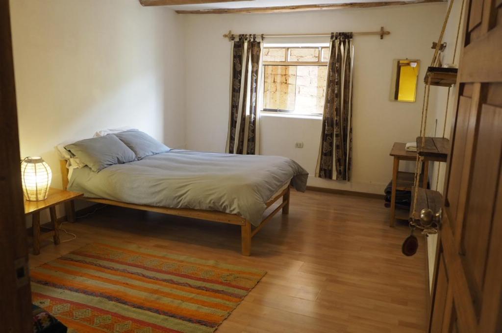 Postel nebo postele na pokoji v ubytování La Chakana Pisac