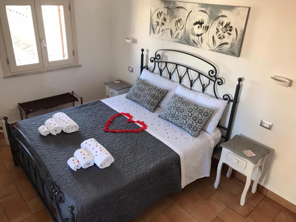 מיטה או מיטות בחדר ב-Sopra i tetti di Ballarò