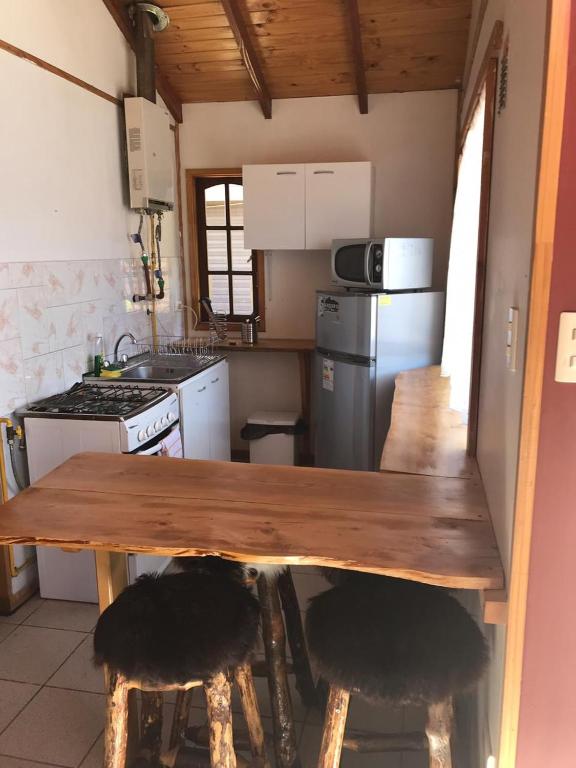 Majoituspaikan Apart Hotel y Cabañas Valle Exploradores keittiö tai keittotila