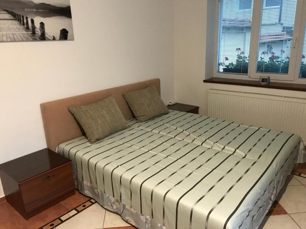 Posteľ alebo postele v izbe v ubytovaní RRR Apartmány