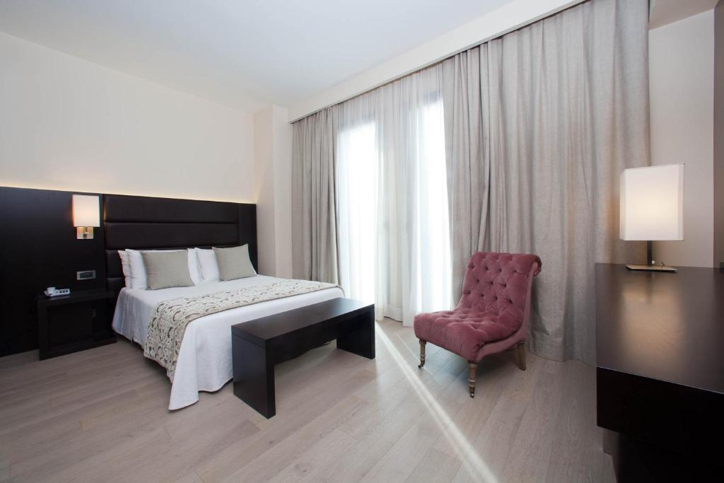Postel nebo postele na pokoji v ubytování Hotel Touring