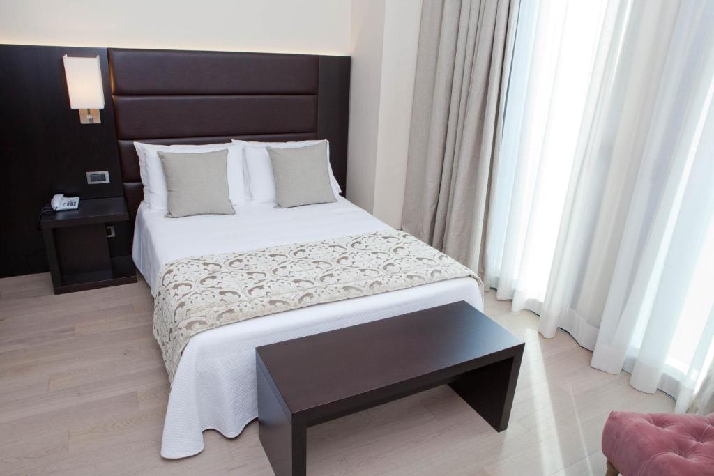 Postel nebo postele na pokoji v ubytování Hotel Touring