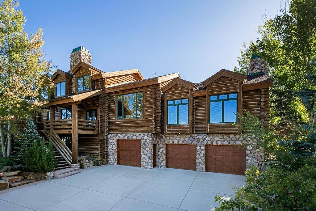 a large wooden house with a garage at Park City Homes by White Pines Solamere in Park City