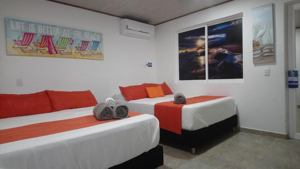 Hotel Mare Mare Inn tesisinde bir odada yatak veya yataklar