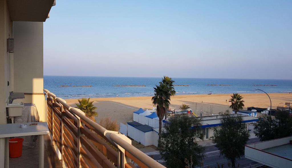 a balcony with a view of the beach at Residenza Adriatica 2 in Roseto degli Abruzzi