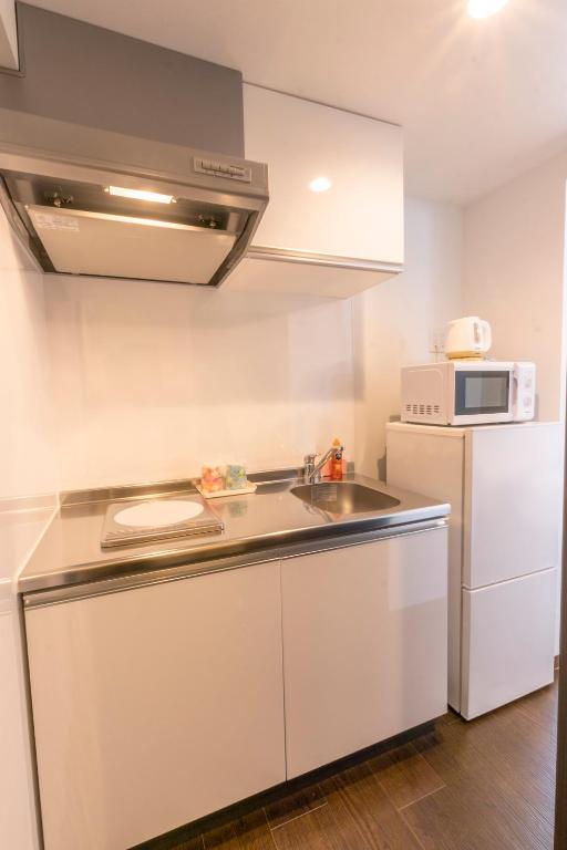 Kuchyň nebo kuchyňský kout v ubytování HOTEL HOUKLEA