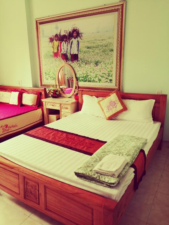 Postel nebo postele na pokoji v ubytování Thien An Guest House