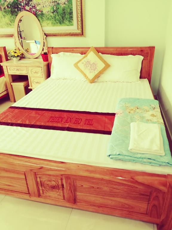 Postel nebo postele na pokoji v ubytování Thien An Guest House