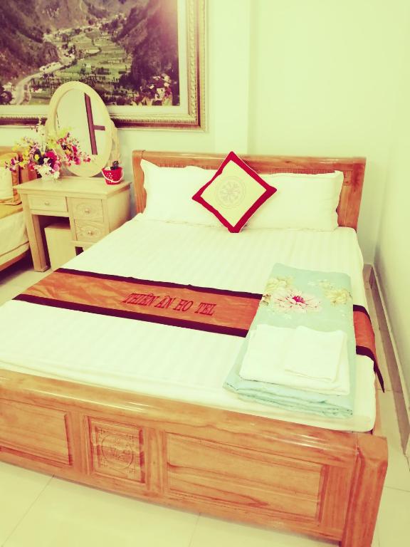 Postel nebo postele na pokoji v ubytování Thien An Guest House