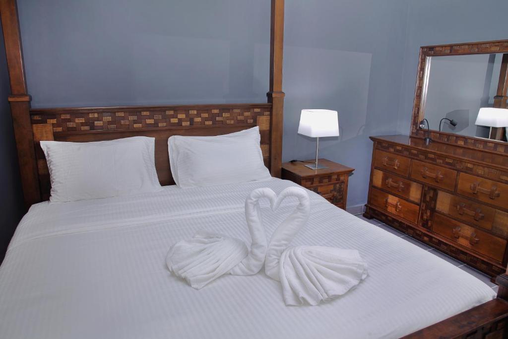 Postel nebo postele na pokoji v ubytování Hotel ali Imran