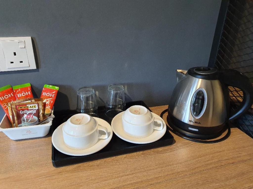 Příslušenství pro přípravu čaje a kávy v ubytování Hotel ali Imran