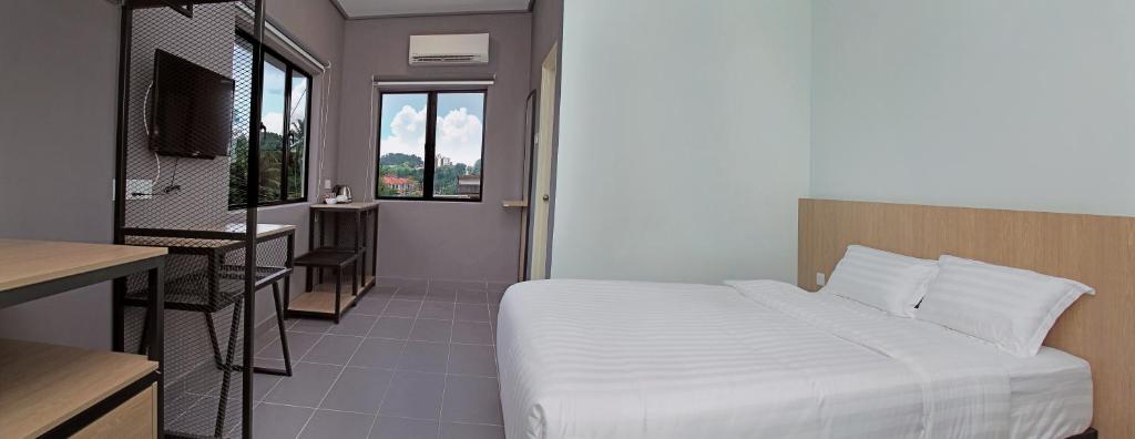 Postel nebo postele na pokoji v ubytování Hotel ali Imran