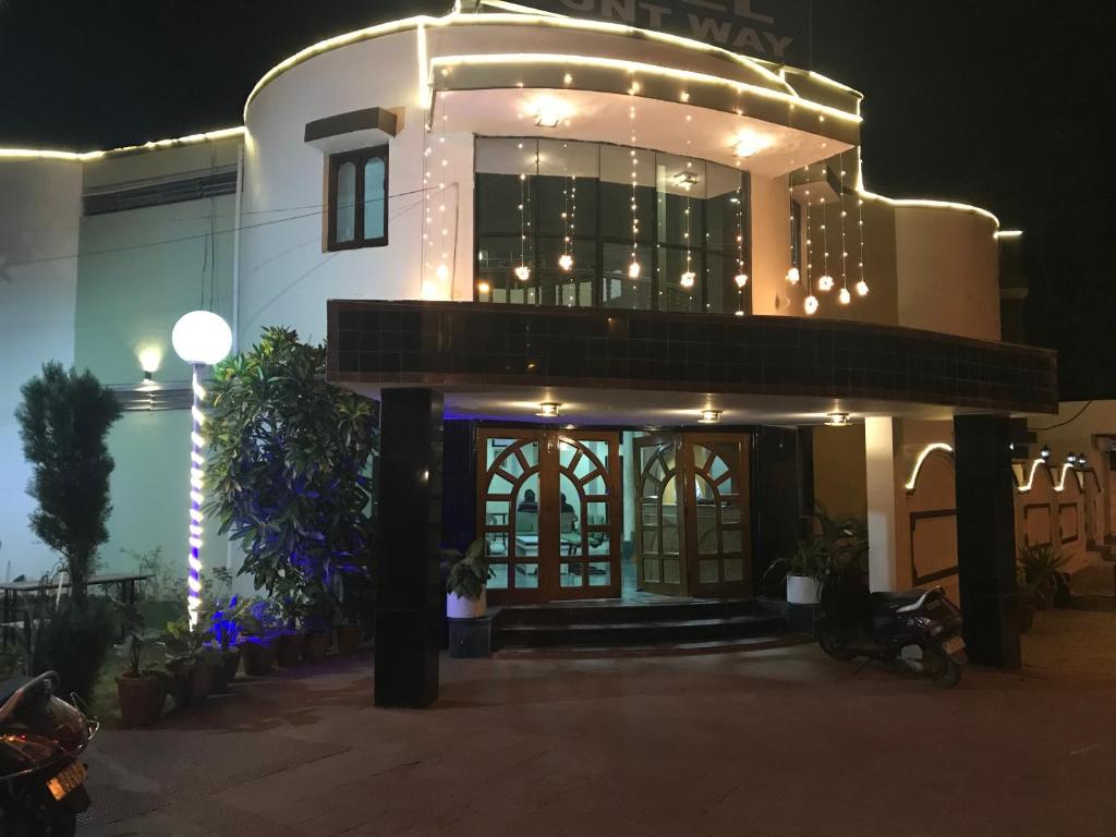 a building with lights on it at night at Hotel Mount Way in Ābu Road
