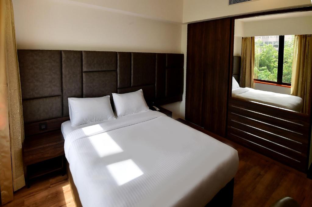 Postel nebo postele na pokoji v ubytování Hotel Ranjith