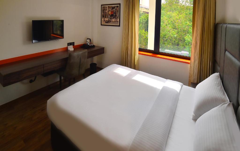Postel nebo postele na pokoji v ubytování Hotel Ranjith