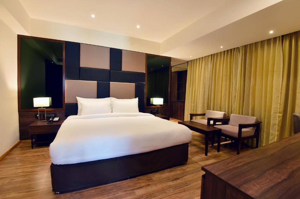 Postel nebo postele na pokoji v ubytování Hotel Ranjith