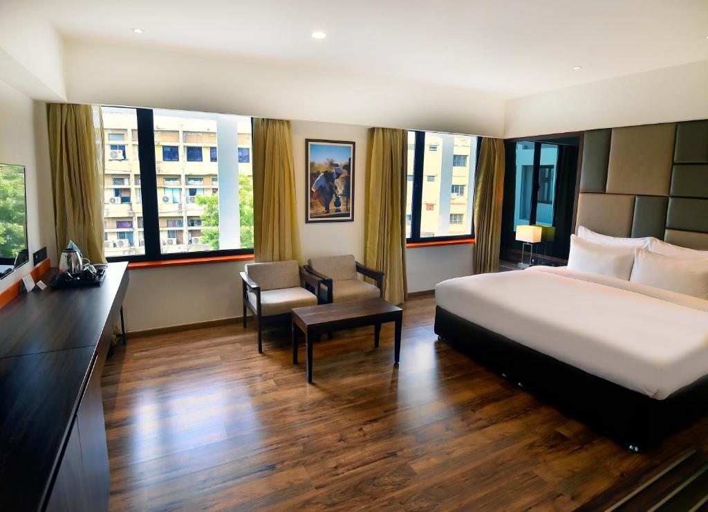 Postel nebo postele na pokoji v ubytování Hotel Ranjith