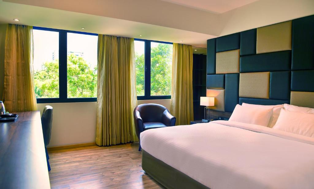 Postel nebo postele na pokoji v ubytování Hotel Ranjith