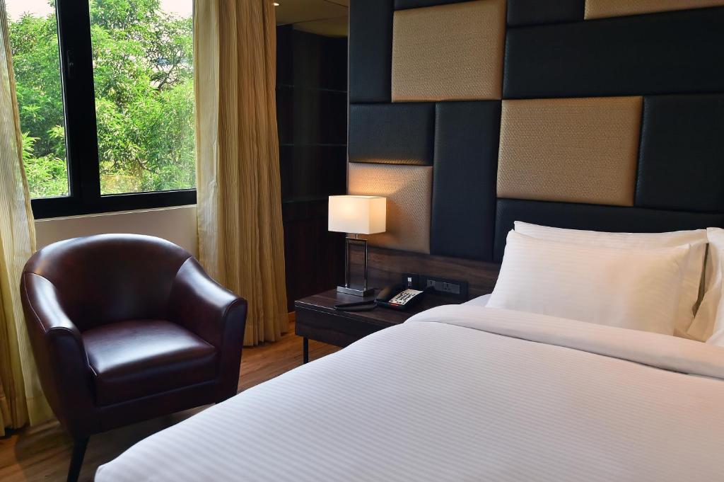 Postel nebo postele na pokoji v ubytování Hotel Ranjith