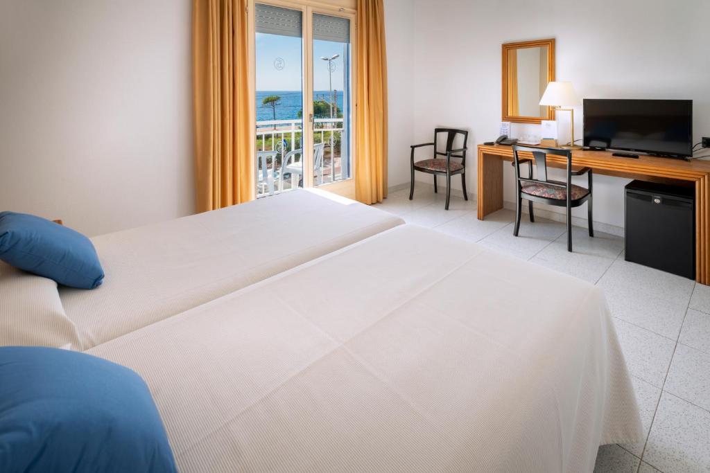 Postel nebo postele na pokoji v ubytování Hotel Sorrabona