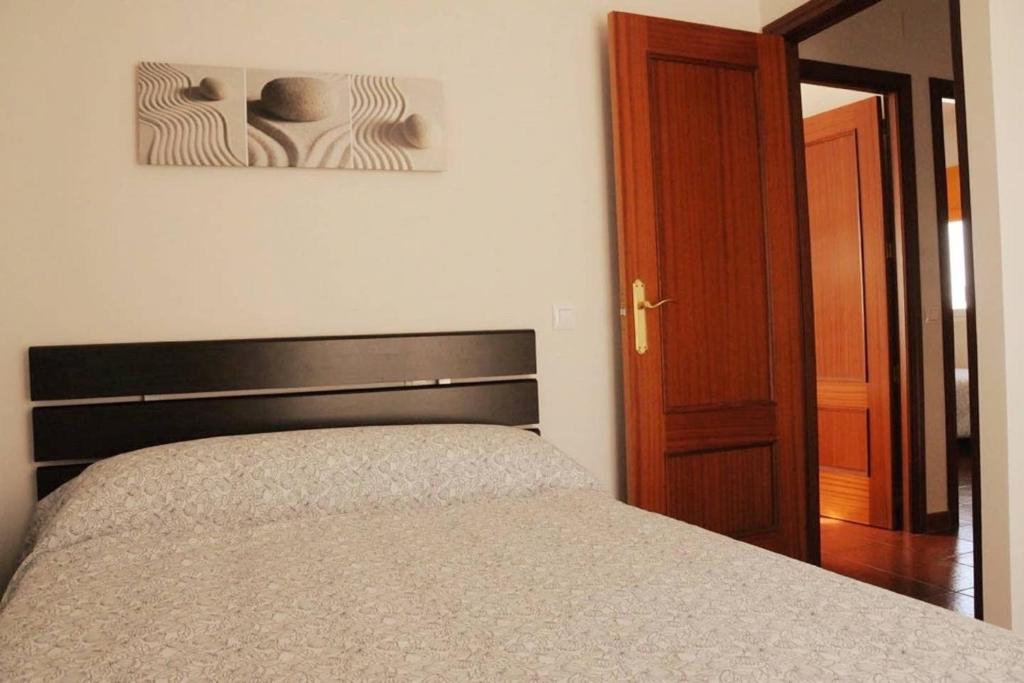 Postel nebo postele na pokoji v ubytování Aracena Suites