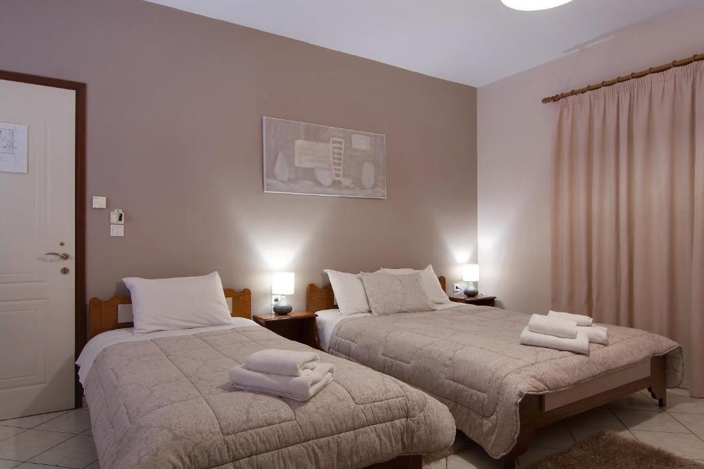 Postel nebo postele na pokoji v ubytování Tsironis Guesthouse