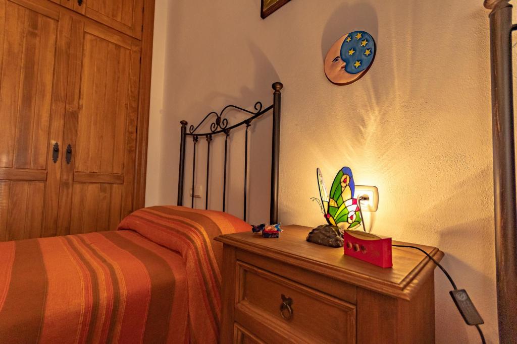 Postel nebo postele na pokoji v ubytování Cubo's Villa Ana Valtocado