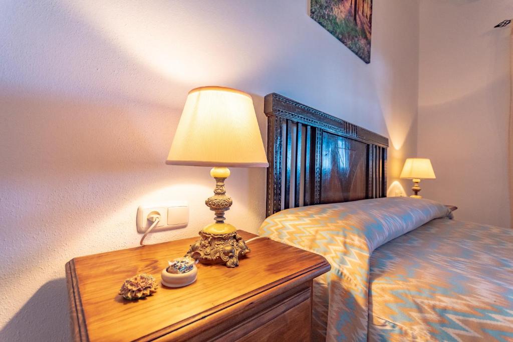 Postel nebo postele na pokoji v ubytování Cubo's Villa Ana Valtocado