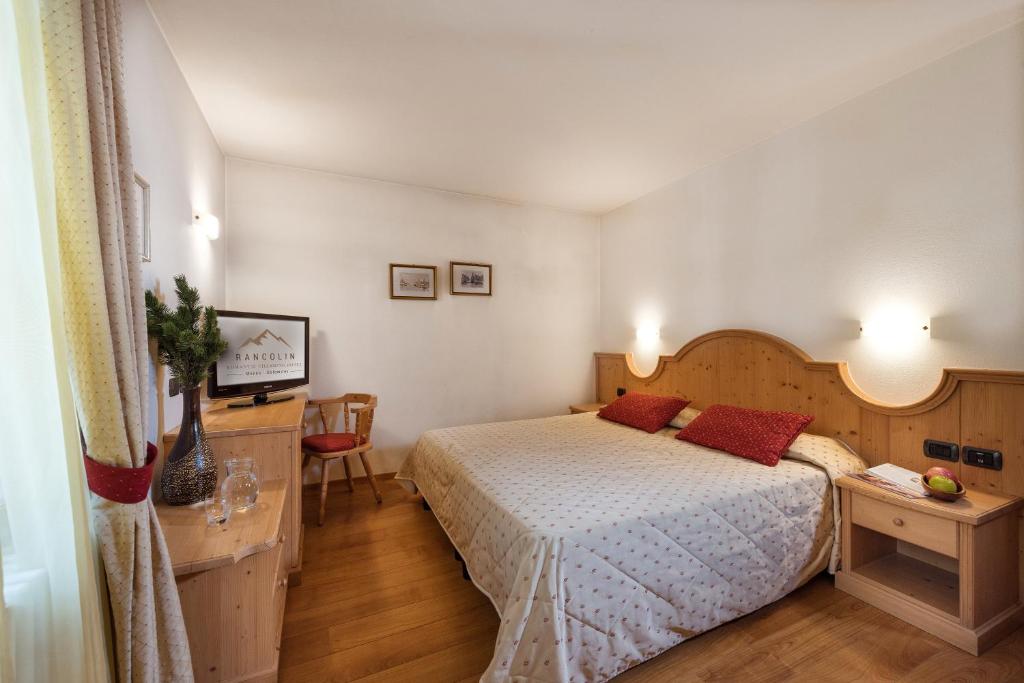 Postel nebo postele na pokoji v ubytování Romantic Charming Hotel Rancolin