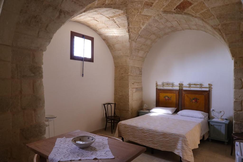 Postel nebo postele na pokoji v ubytování masseria Carlini