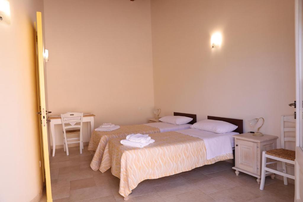 Postel nebo postele na pokoji v ubytování masseria Carlini