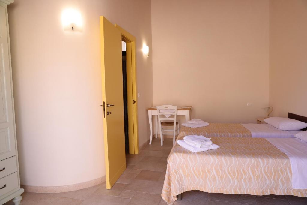 Postel nebo postele na pokoji v ubytování masseria Carlini