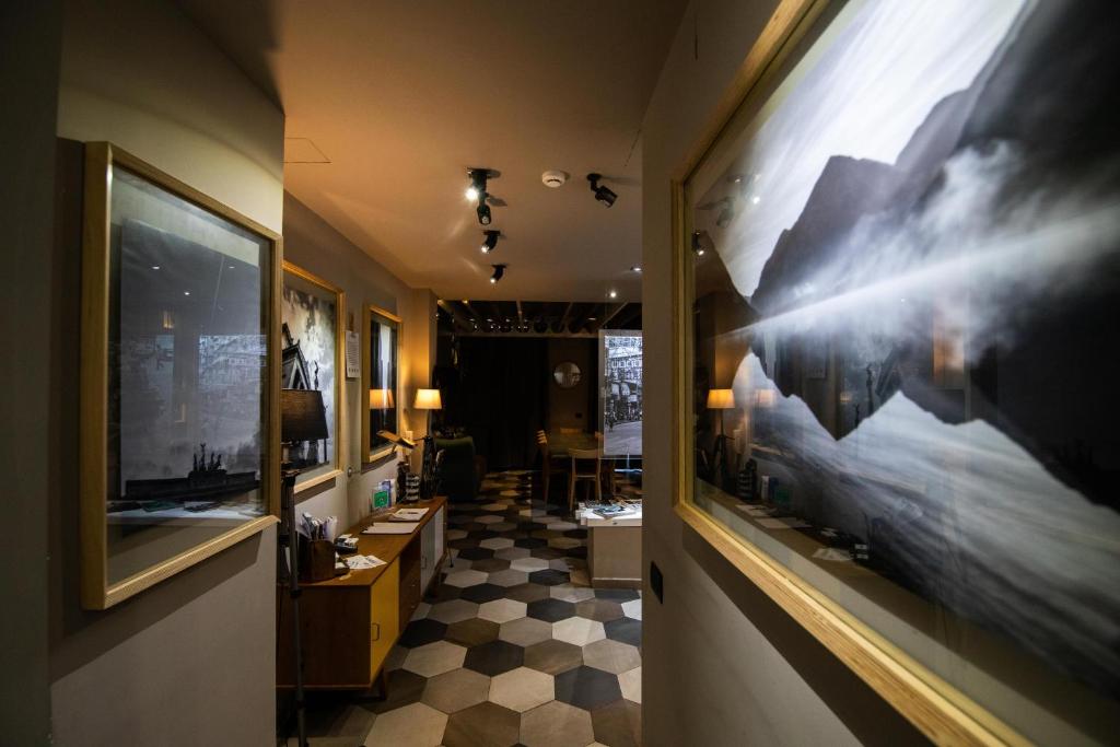 a hallway with a large picture on the wall at Vinto House Salerno Downtown in Salerno