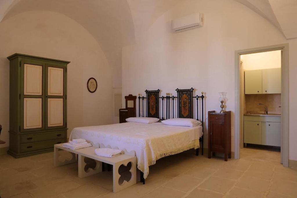 Postel nebo postele na pokoji v ubytování masseria Carlini
