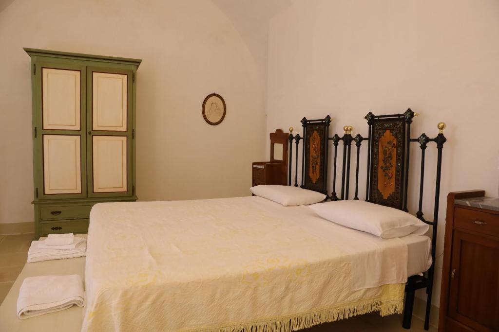 Postel nebo postele na pokoji v ubytování masseria Carlini