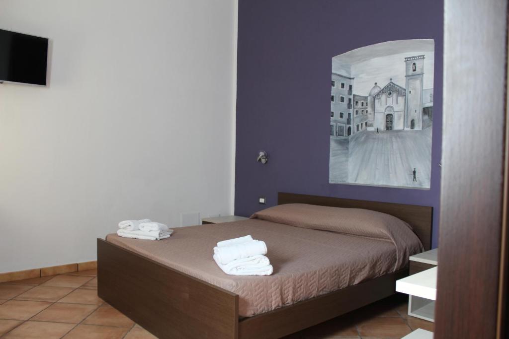 Letto o letti in una camera di Room and Breakfast I Gemelli