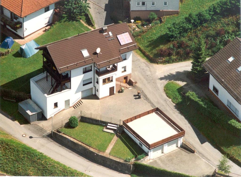 an overhead view of a white house with a brown roof at Ferienhaus KorsikaBlick in Unter Schönmattenwag