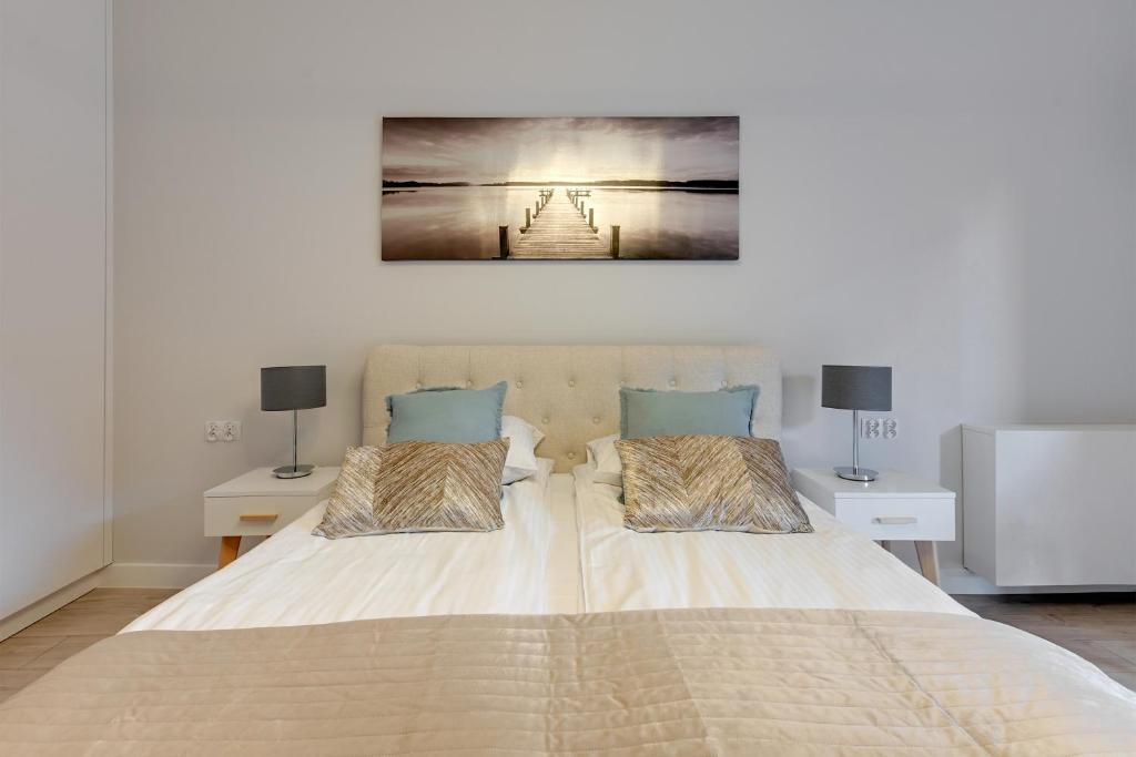 Postel nebo postele na pokoji v ubytování Comfort Apartments Rajska