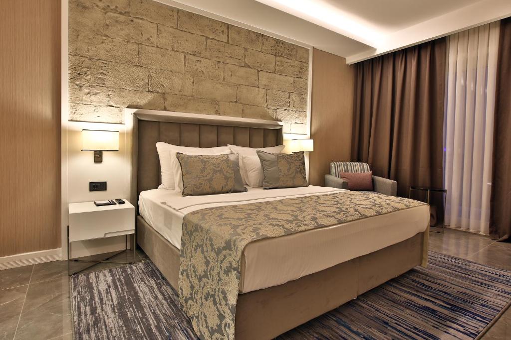 Postel nebo postele na pokoji v ubytování Mardin Airport hotel