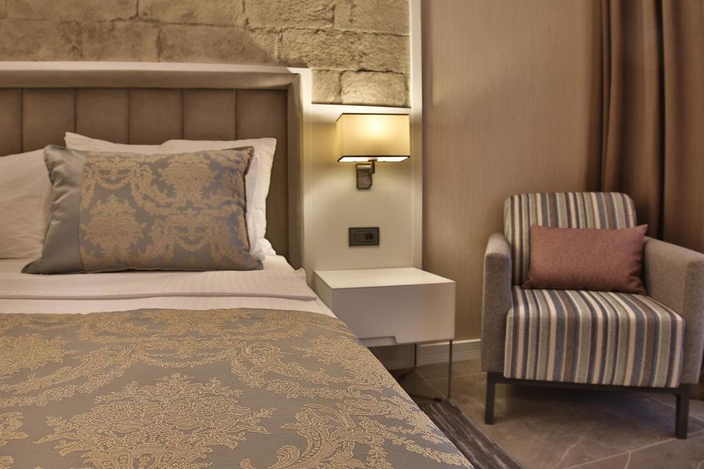 Postel nebo postele na pokoji v ubytování Mardin Airport hotel